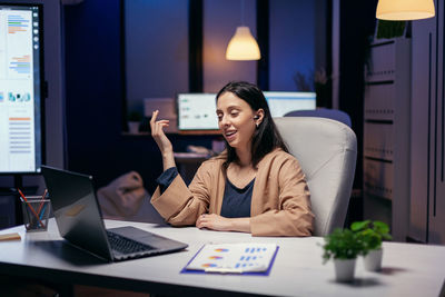 Smiling businesswoman working in office