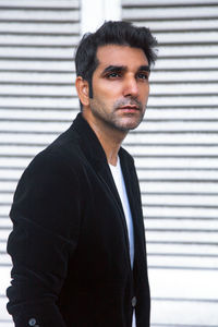 Portrait of young man standing outdoors