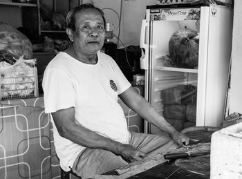 Portrait of man standing in store