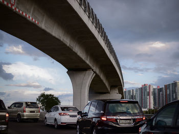 Cars on road against sky