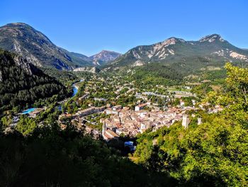 Scenic view of mountains against clear blue sky