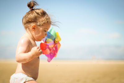 Full length of woman at beach against sky