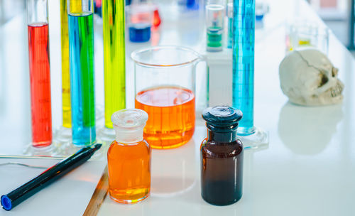 High angle view of multi colored bottles on table