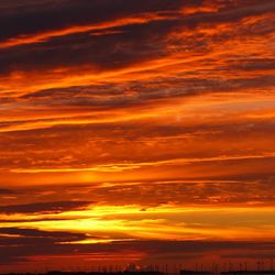 Scenic view of dramatic sky during sunset