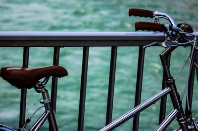 Close-up of bicycle on railing