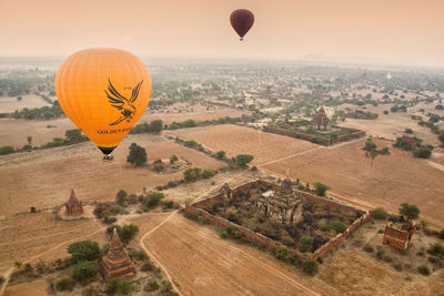 Hot air balloon flying over landscape