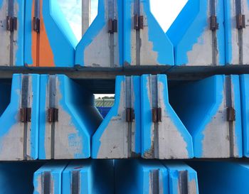 Close-up of metallic structure against blue sky