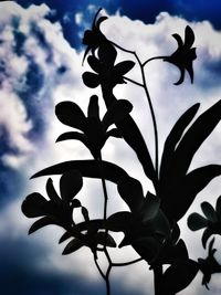 Low angle view of silhouette flower against sky