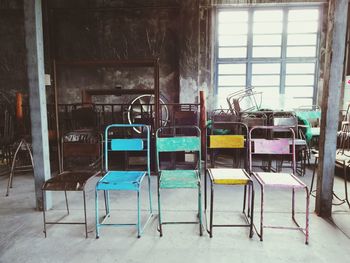 Damaged chairs in abandoned room