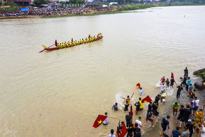 High angle view of people enjoying in river