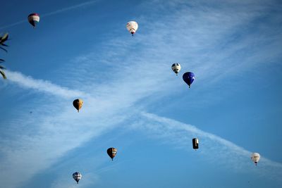 Low angle view of hot air balloons against sky
