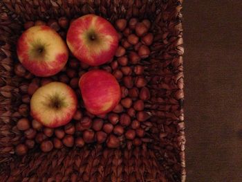 High angle view of apples in basket on table