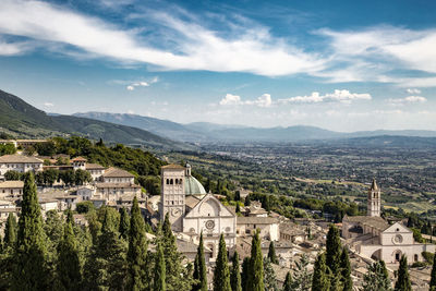 High angle view of town against cloudy sky