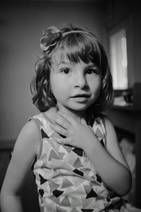 Portrait of girl sitting at home