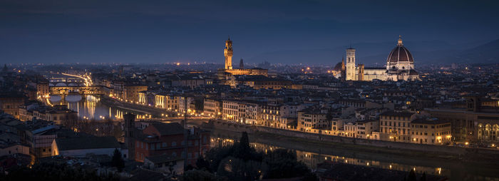 Aerial view of illuminated city at night