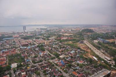 High angle view of buildings in city against sky