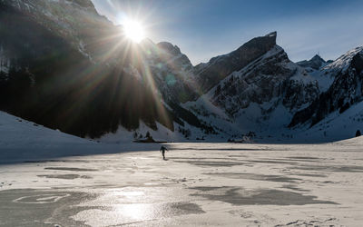 Scenic view of snowcapped mountains against sky during winter