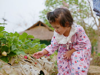 Girl holding plant