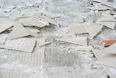 High angle view of broken tiles on floor