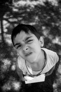 High angle portrait of boy standing on land