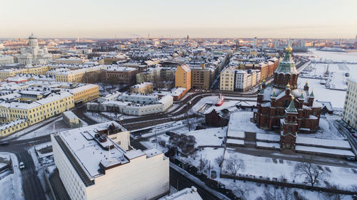 High angle view of buildings in city during winter