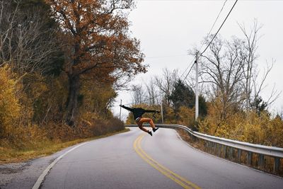 Man jumping on road