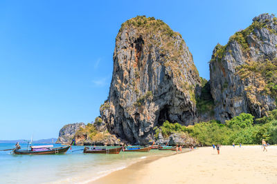 Panoramic view of beach against clear blue sky