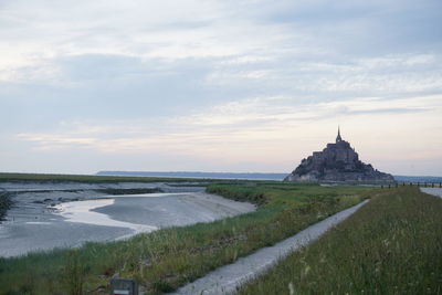 View of castle against cloudy sky