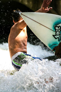 Man surfing at sea