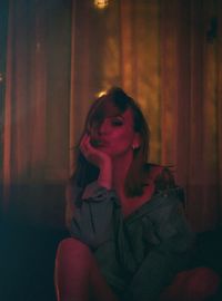 Portrait of young woman sitting at home