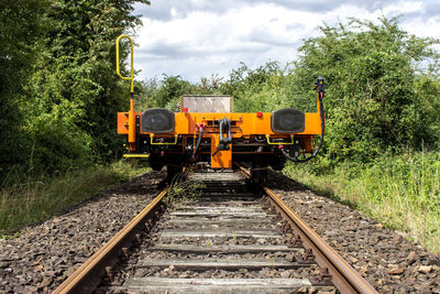 Train on railroad track against sky