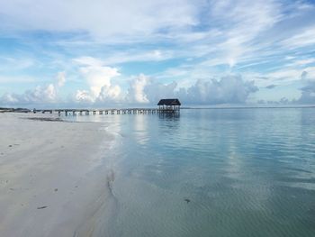 View of calm sea against cloudy sky