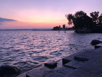 Scenic view of sea against orange sky