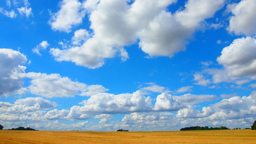 Scenic view of landscape against cloudy sky