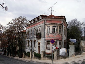 Street by building against sky