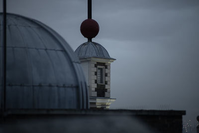 Tower in city against sky