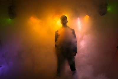 Silhouette man standing against sky