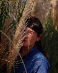 A young woman in a thicket of pampas grass