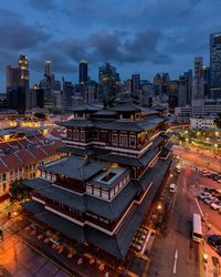 High angle view of city lit up at night