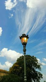 Low angle view of street light against sky