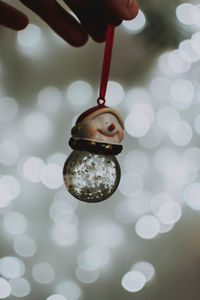 Close-up of hand holding christmas decoration