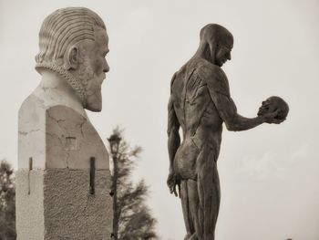 Low angle view of statue against sky