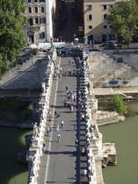 High angle view of people walking on bridge