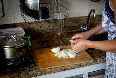Cook cutting an onion into slices. healthy eating.