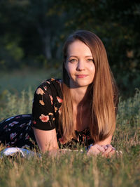 Portrait of a beautiful young woman in field