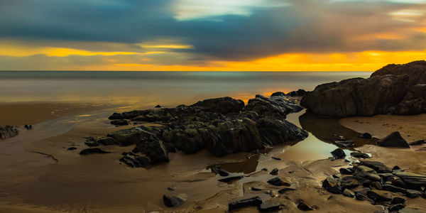 Scenic view of sea at sunset