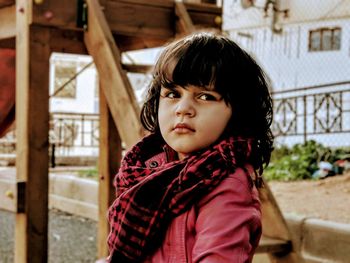 Portrait of girl standing outdoors