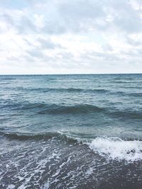 Scenic view of sea against cloudy sky