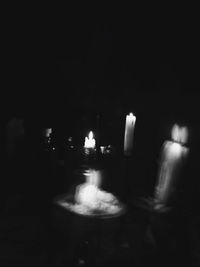 Blurred motion of illuminated candles