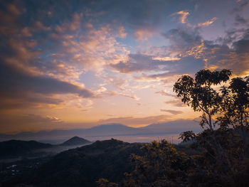 Scenic view of mountains against sky during sunset